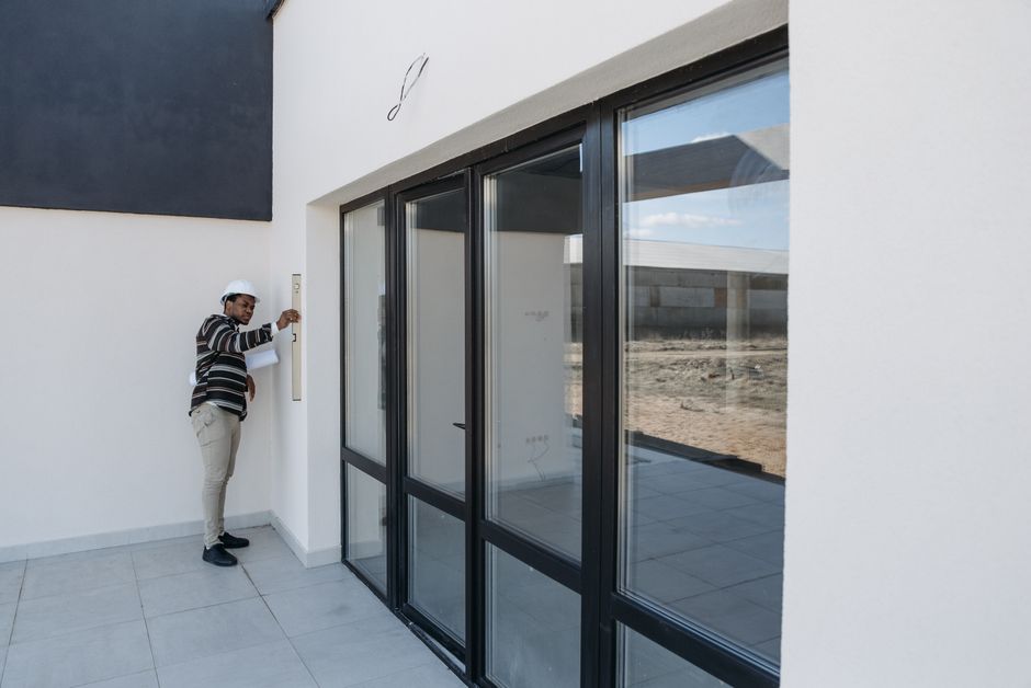 Contractor installing wooden door